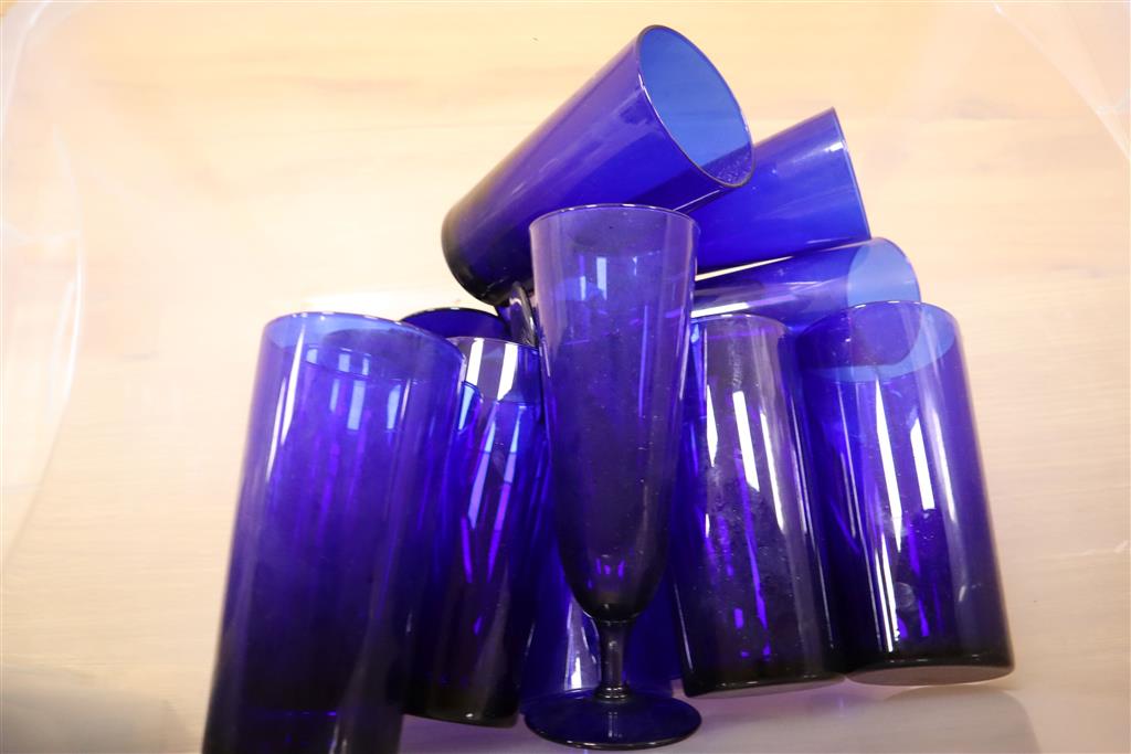 A collection of black, clear blue and crystal blue drinking glasses